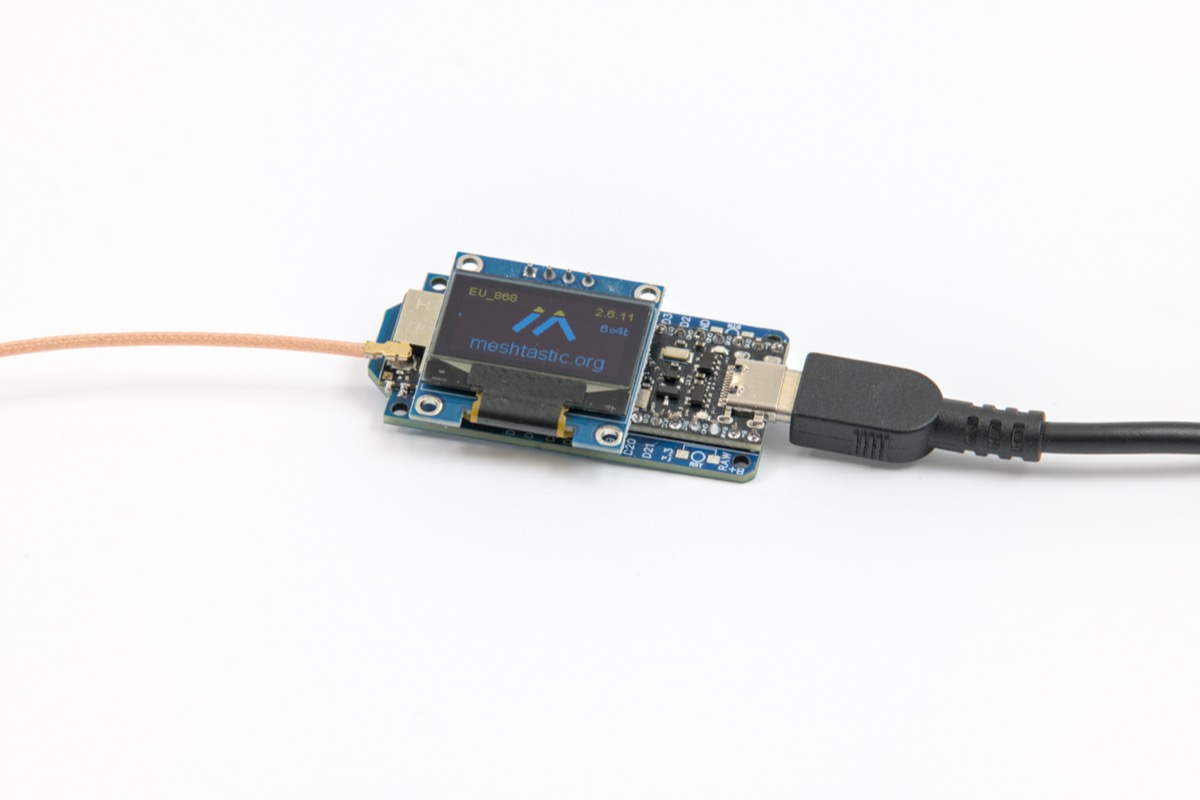 Meshtastic node with LoRa transceiver and display showing mesh network interface